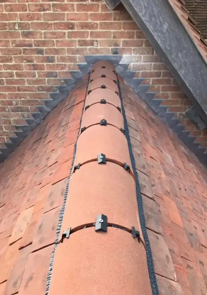 Roofing company bromsgrove working on pitched roof construction with skylights